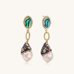 Gold-plated statement earrings with iridescent abalone shells, rope chain links, and crystal-capped baroque pearls