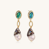 Gold-plated statement earrings with iridescent abalone shells, rope chain links, and crystal-capped baroque pearls