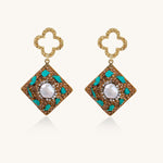 Gold quatrefoil stud earrings with ornate square pendants featuring turquoise stones and freshwater pearls