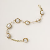 14K gold plated bracelet featuring wire-wrapped freshwater pearls in nest-like settings with adjustable chain closure