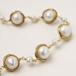 14K gold plated bracelet featuring wire-wrapped freshwater pearls in nest-like settings with adjustable chain closure