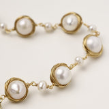 14K gold plated bracelet featuring wire-wrapped freshwater pearls in nest-like settings with adjustable chain closure
