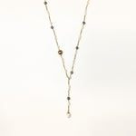 Long gold-plated necklace with alternating white and gray freshwater pearls spaced along delicate chain segments