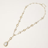 Y-shaped gold-plated necklace with freshwater pearls and geometric elements, featuring a baroque pearl pendant drop