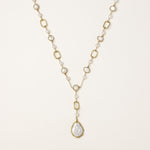Y-shaped gold-plated necklace with freshwater pearls and geometric elements, featuring a baroque pearl pendant drop