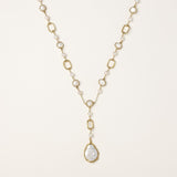 Y-shaped gold-plated necklace with freshwater pearls and geometric elements, featuring a baroque pearl pendant drop