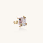 Gold-plated ring featuring large baroque freshwater pearl with small colorful gemstone accents on textured band
