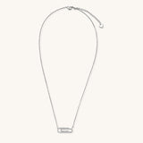 Delicate 14K gold plated chain necklace with crystal-accented carabiner-style pendant on white background