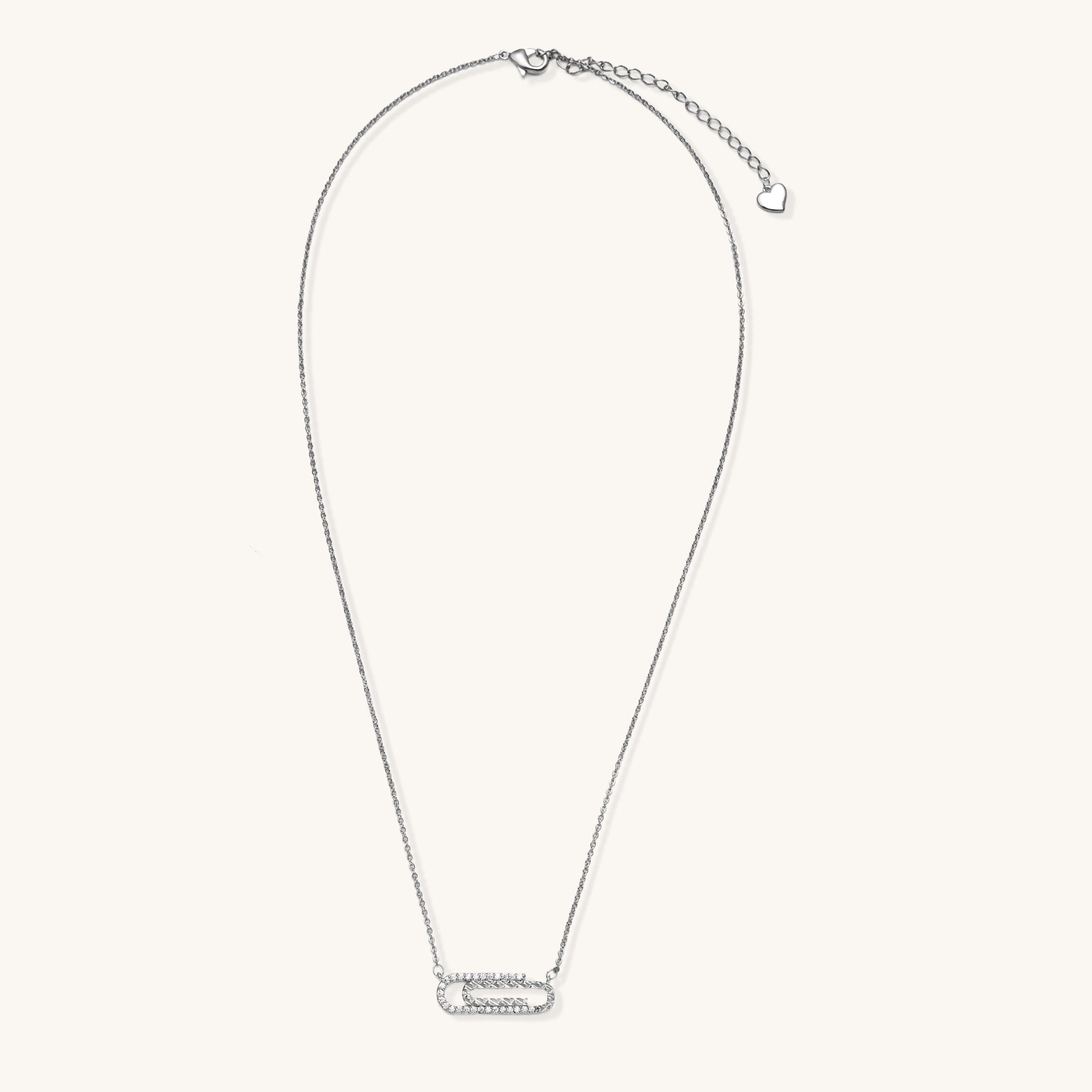 Delicate 14K gold plated chain necklace with crystal-accented carabiner-style pendant on white background