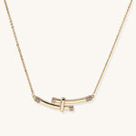 Elegant 14K gold plated necklace featuring two curved bars with diamond accents on adjustable chain