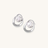 Gold-plated brass stud earrings with swirled circular design holding white freshwater pearls and small crystals