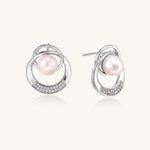 Gold-plated brass stud earrings with swirled circular design holding white freshwater pearls and small crystals