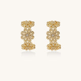 Ornate gold-plated brass hoop earrings featuring delicate floral filigree patterns and intricate rosette details.