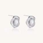 Gold-plated stud earrings with central freshwater pearl surrounded by baguette crystals in radial pattern