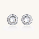 Gold-plated stud earrings with central freshwater pearl surrounded by baguette crystals in radial pattern