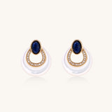 Gold-plated drop earrings featuring blue lapis lazuli ovals, diamond-studded circles, and iridescent mother of pearl teardrops