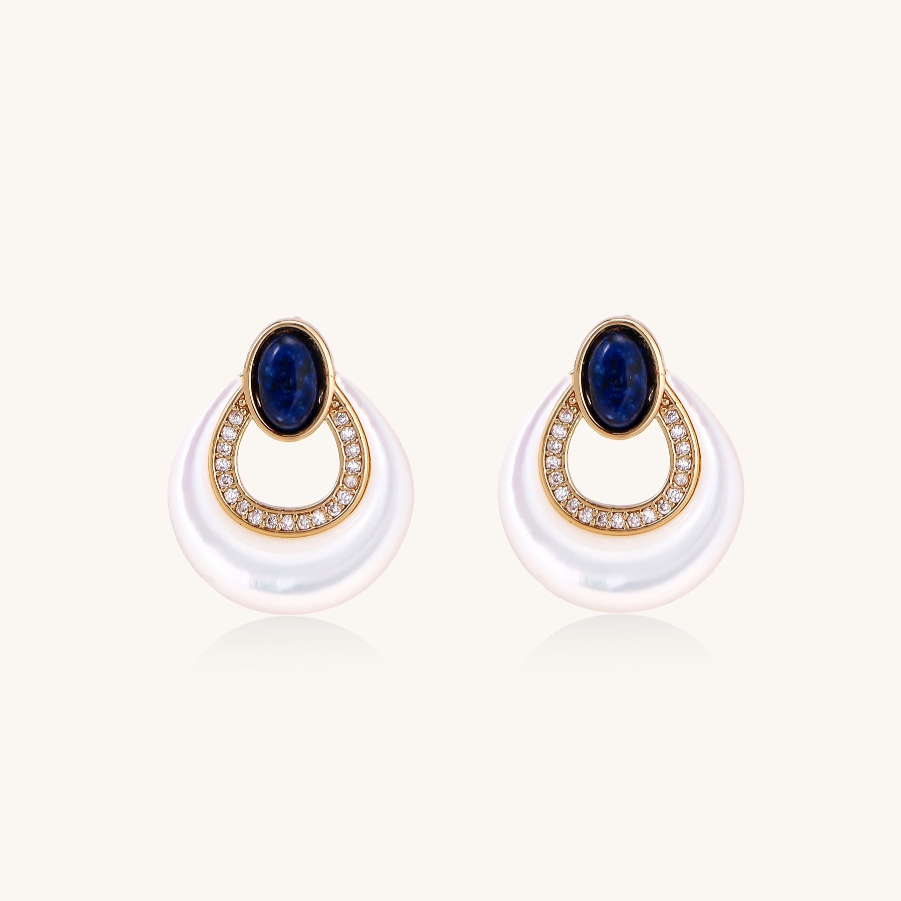 Gold-plated drop earrings featuring blue lapis lazuli ovals, diamond-studded circles, and iridescent mother of pearl teardrops