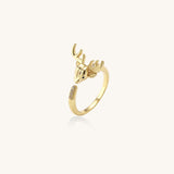 Gold-plated brass deer antler ring with cubic zirconia stones featuring detailed stag head design on white background.