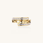 Gold-plated chain-link ring with rhinestone rows on cream background, showing bold geometric design and sparkling details.