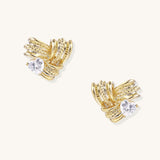 Close-up of gold-plated twisted rope design stud earrings with clear zirconia crystals on white background.