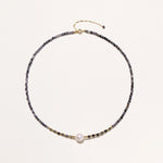 Dainty necklace with faceted purple iolite beads, gold vermeil accents, and central pink-white freshwater pearl.