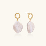 18K gold vermeil twisted circle studs with organic white baroque pearl drops on cream background
