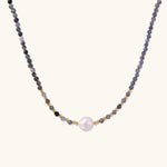 Dainty necklace with faceted purple iolite beads, gold vermeil accents, and central pink-white freshwater pearl.