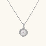 Cushion-shaped double halo pendant with 10mm freshwater pearl center on rhodium-plated sterling silver chain