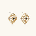 Gold filigree stud earrings with navy lapis lazuli center stone and mother-of-pearl accents in ornate quatrefoil design
