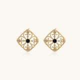 Gold filigree stud earrings with navy lapis lazuli center stone and mother-of-pearl accents in ornate quatrefoil design