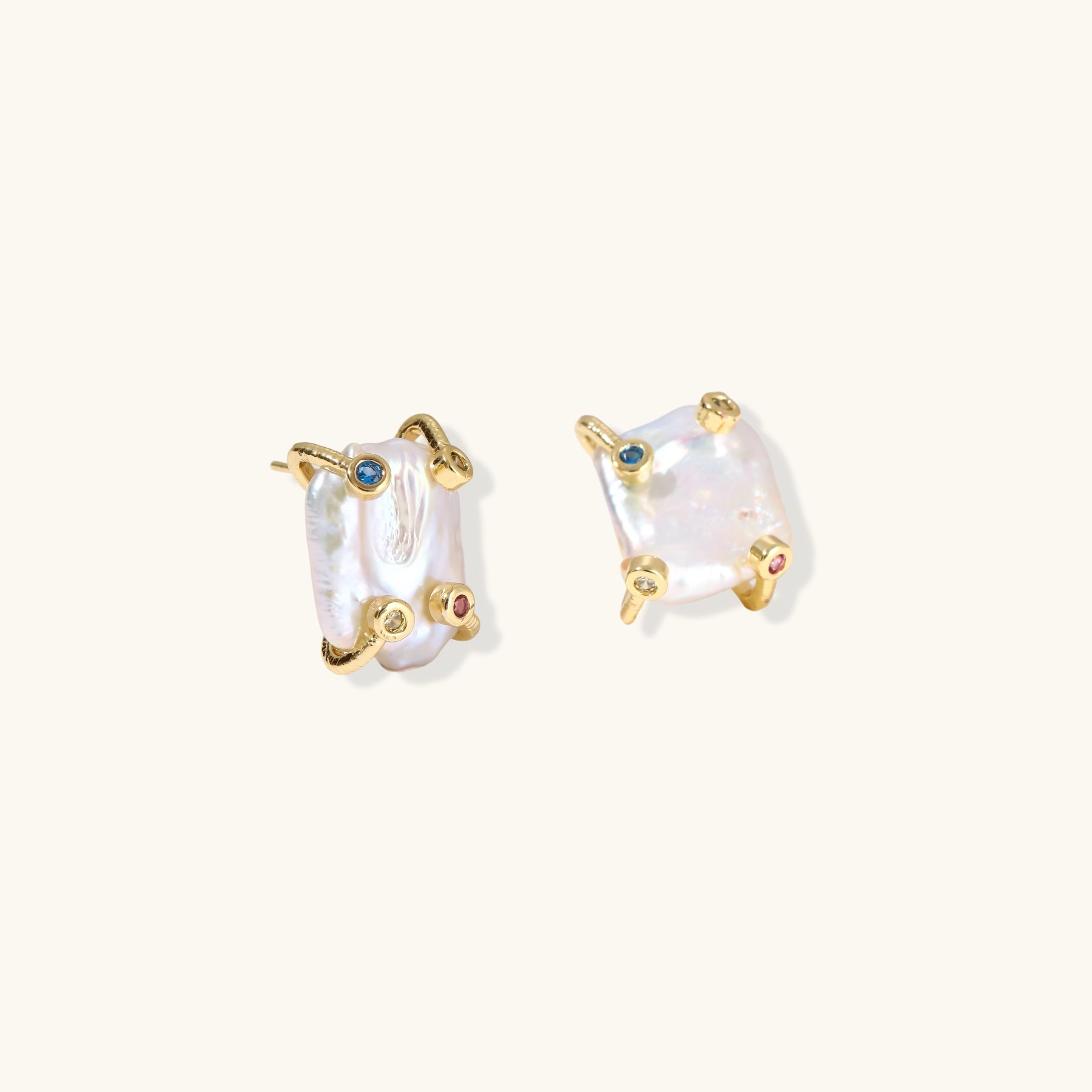 Baroque pearl studs in gold-plated prong setting with four multicolor gemstones on each corner, front and side view