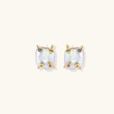 Baroque pearl studs in gold-plated prong setting with four multicolor gemstones on each corner, front and side view