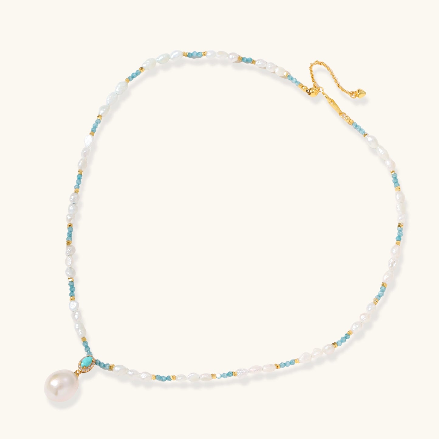 Beaded necklace with baroque pearls, turquoise stones, and gold accents featuring a large pearl pendant on white background.