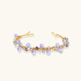Gold-plated adjustable cuff bracelet with clustered lavender fluorite, turquoise beads, and freshwater pearls on white background.