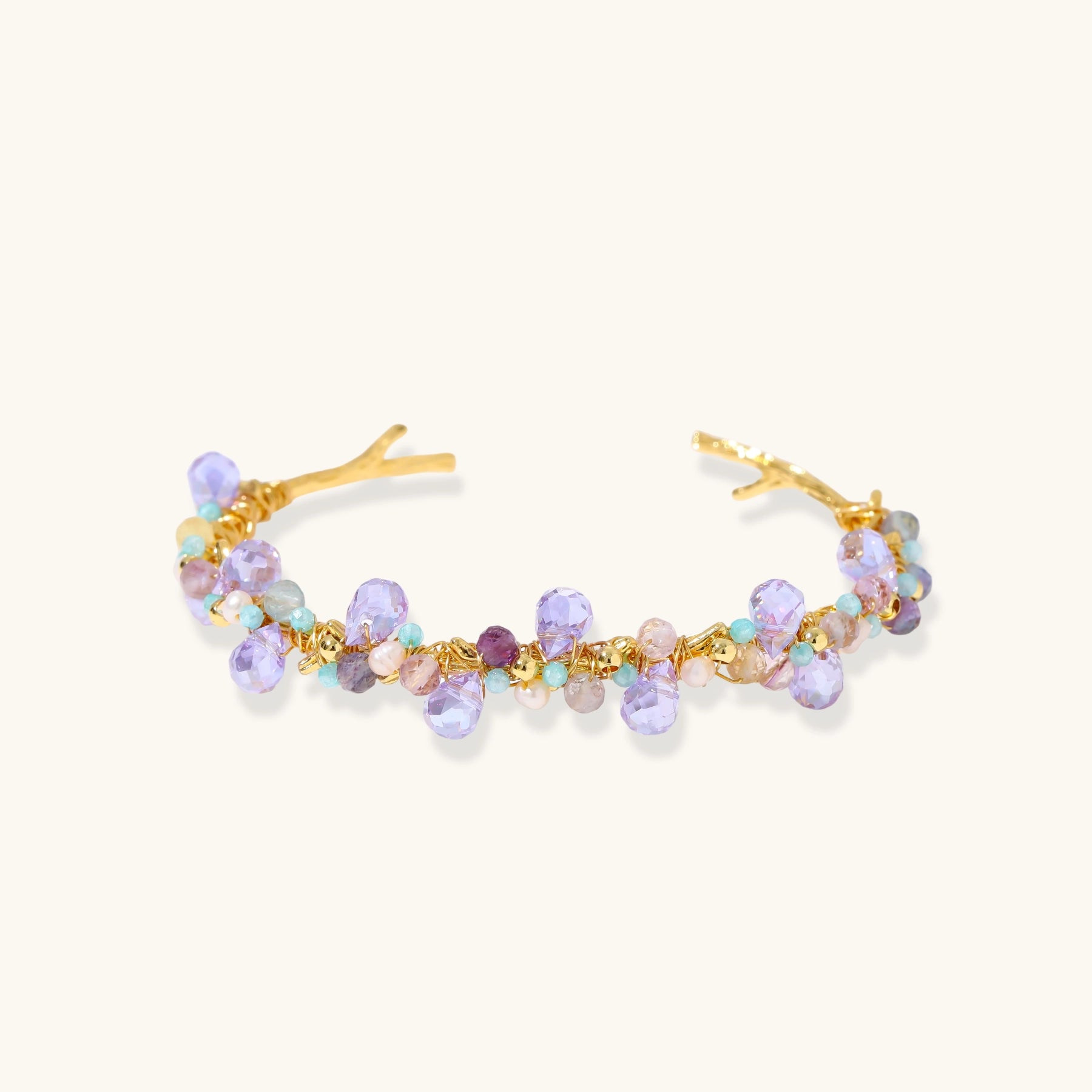 Gold-plated adjustable cuff bracelet with clustered lavender fluorite, turquoise beads, and freshwater pearls on white background.
