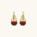 Modern drop earrings with curved gold-plated copper tops and amber resin bottoms creating an organic teardrop silhouette.