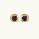 Gold-plated octagonal stud earrings with burgundy liuli centers and cubic zirconia halos on white background