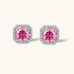 Pink moissanite studs in octagonal sterling silver halo settings with sparkling accent stones on cream background.