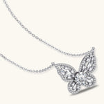 Sterling silver butterfly pendant with radiating design and central moissanite stone on adjustable chain