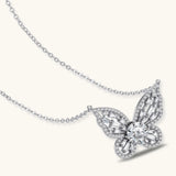 Sterling silver butterfly pendant with radiating design and central moissanite stone on adjustable chain