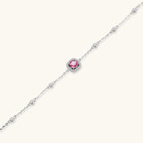 Elegant sterling silver chain bracelet featuring pink moissanite center stone in cushion halo setting with adjustable clasp