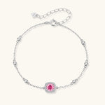 Elegant sterling silver chain bracelet featuring pink moissanite center stone in cushion halo setting with adjustable clasp