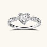 Complete jewelry set with heart-shaped sterling silver pieces featuring brilliant moissanite stones on white background.