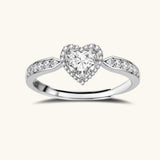 Complete jewelry set with heart-shaped sterling silver pieces featuring brilliant moissanite stones on white background.