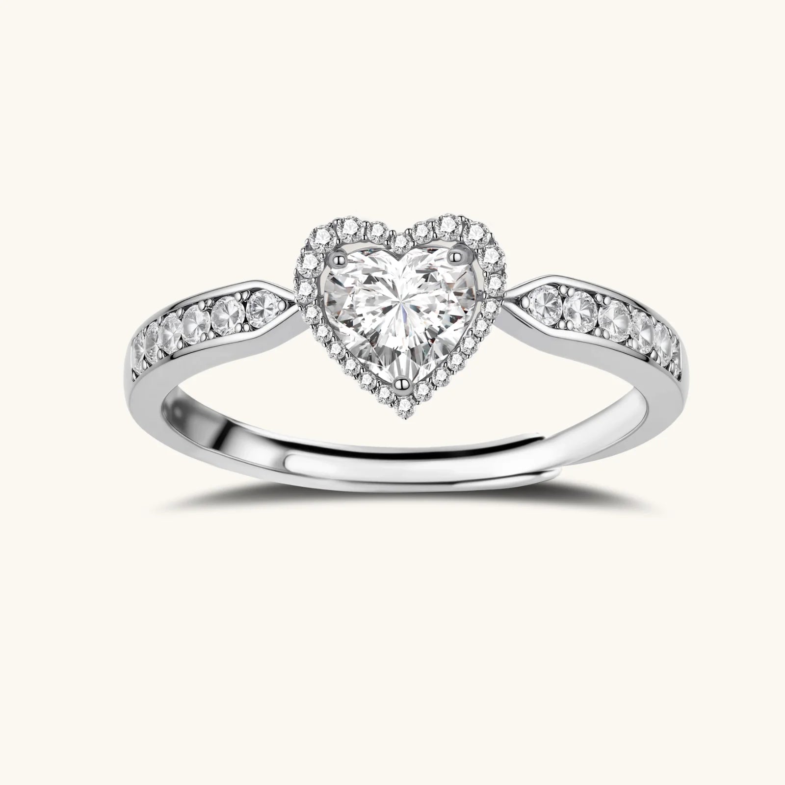 Complete jewelry set with heart-shaped sterling silver pieces featuring brilliant moissanite stones on white background.