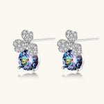 Sterling silver stud earrings with four-leaf clover design featuring small crystals above round moissanite stones