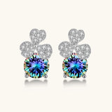 Sterling silver stud earrings with four-leaf clover design featuring small crystals above round moissanite stones