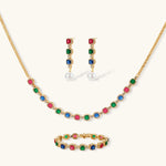 Gold-plated jewelry set with red, green, and blue cubic zirconia stones including necklace, bracelet, and drop earrings.