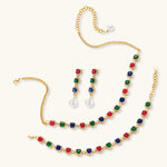 Gold-plated jewelry set with red, green, and blue cubic zirconia stones including necklace, bracelet, and drop earrings.