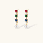 Gold-plated jewelry set with red, green, and blue cubic zirconia stones including necklace, bracelet, and drop earrings.